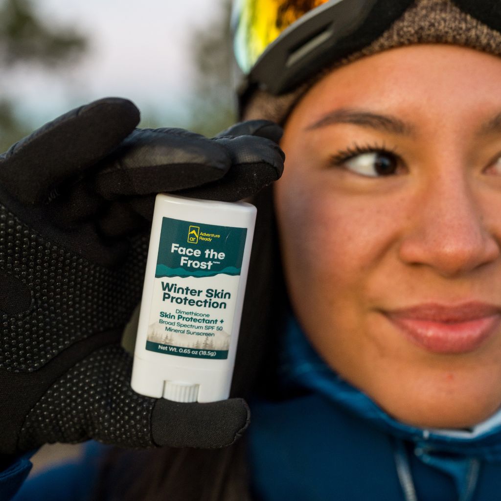 Close-up of a woman holding Face the Frost